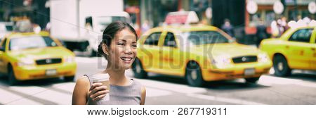 New York city commute - Asian business woman walking to work in the morning commuting drinking coffee cup on NYC street with yellow cabs in the background banner. People commuters lifestyle.