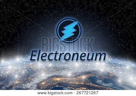 Concept Of Electroneum Coin Floating Over World Network, A Cryptocurrency Blockchain Platform , Digi