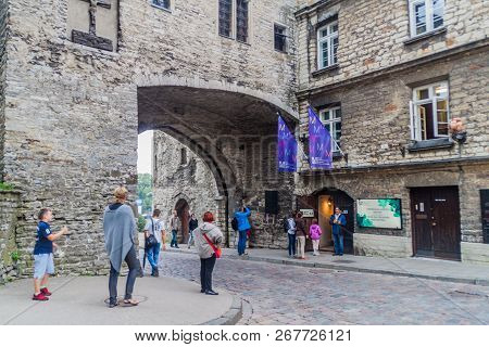 Tallinn, Estonia - August 22, 2016: Pikk Street Leading Through A Gate Next To Fat Margaret Tower In