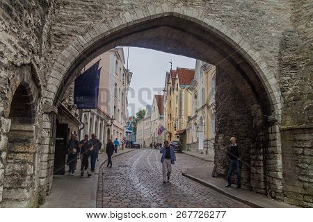 Tallinn, Estonia - August 22, 2016: Pikk Street Leading Through A Gate Next To Fat Margaret Tower In