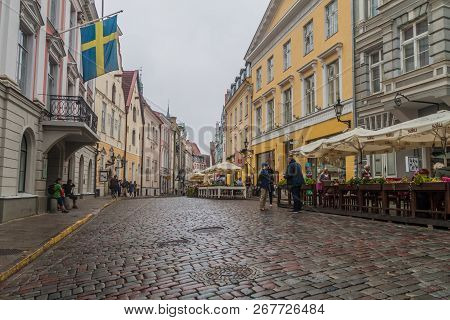 Tallinn, Estonia - August 22, 2016: People Walk Along Cobbled Pikk Street In The Old Town Of Tallinn