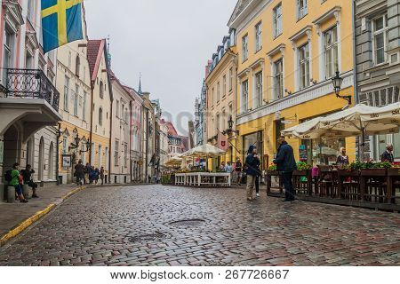 Tallinn, Estonia - August 22, 2016: People Walk Along Cobbled Pikk Street In The Old Town Of Tallinn