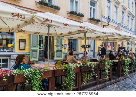Tallinn, Estonia - August 22, 2016: People Eat In A Restaurant At Pikk Street In The Old Town Of Tal