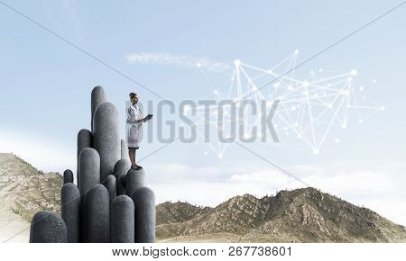 Young Female Doctor With Folder In Hands Satnding On Stone Column. 3d Rendering
