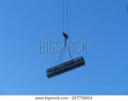 Hoist Of The Crane With A Heavy Load. Abstract Industrial Backgr