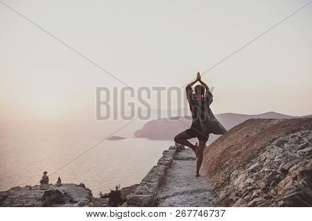 Woman Standing And Meditating In Monolithos, Rhodes, Greece