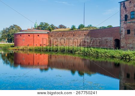 Fortification Walls Of Malmo Castle Reflecting In Its Moat, Sweden