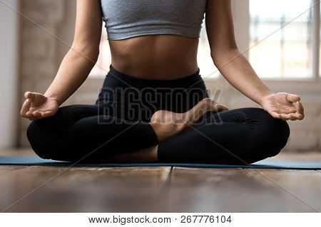 Woman Practicing Yoga, Doing Ardha Padmasana Exercise, Half Lotu