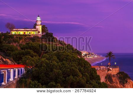 Calella Lighthouse On The Maresme Coast North Of Barcelona.