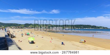 Hendaye, France - June 8: Tourists Enjoy The Beach Of The Charming Seaside Resort Of Hendaye On June
