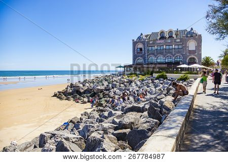 Hendaye, France - June 8: Tourists And Surfers Enjoy The Beach Of The Charming Seaside Resort Of Hen
