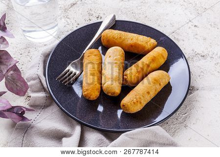 Latin-american Appetizers Called Tequenos Made Of Fried Corn Filled With Cheese.