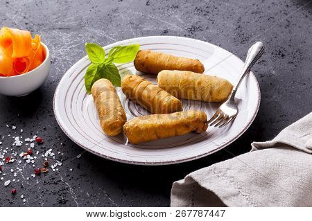 Latin-american Appetizers Called Tequenos Made Of Fried Corn Filled With Cheese.