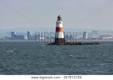 Lighthouse At Small Island Near Coast Of Scottisch Edinburgh
