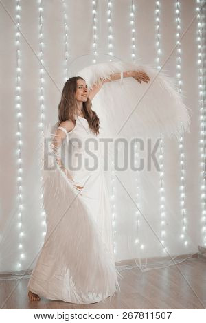 Girl In White Dress With Angel Wings On White Background. Angel-woman