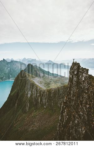 Man Climbing In Norway Traveler Standing On Cliff Rocky Mountain Adventure Extreme Lifestyle Vacatio