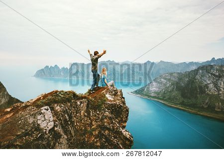 Travel Couple Enjoying View Together On Cliff Edge In Norway Man And Woman Family Healthy Traveling 