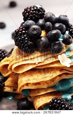 Delicious Tasty Homemade Crepes Or Pancakes With Blackberries,blueberries And Blue Spirulina Nicecre