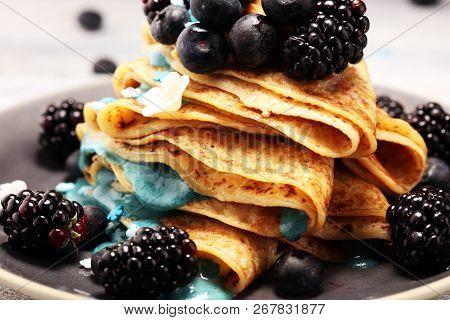 Delicious Tasty Homemade Crepes Or Pancakes With Blackberries,blueberries And Blue Spirulina Nicecre