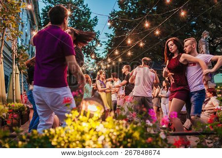 Lviv, Ukraine - August 4, 2018. People Dancing Salsa And Bachata In Outdoor Cafe In Lviv