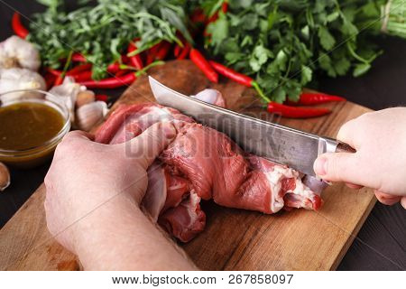 Close-up Cutting Fresh Meat For Cooking Meat Dishes