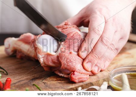 Close-up Cutting Fresh Meat For Cooking Meat Dishes
