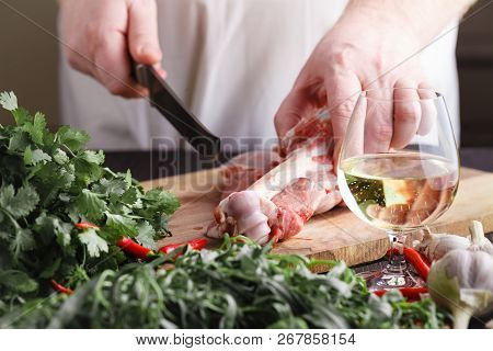 Chef Butcher Cutting Lamb Meat With Knife On Kitchen, Cooking Proteine Food