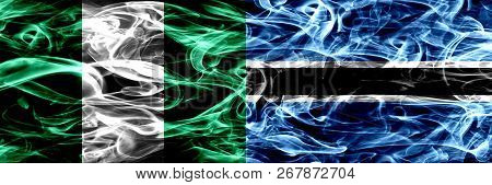 Nigeria, Nigerian Vs Botswana, Botswanan Smoke Flags Placed Side By Side. Thick Abstract Colored Sil