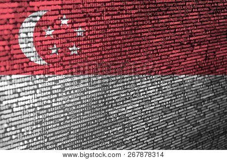 Singapore Flag  Is Depicted On The Screen With The Program Code. The Concept Of Modern Technology An