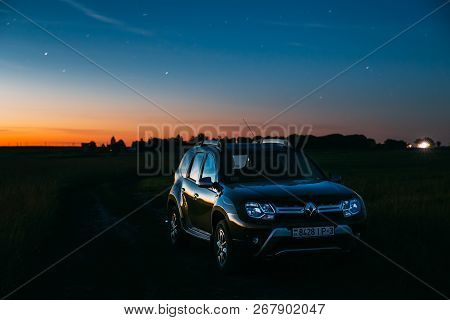 Gomel, Belarus - June 10, 2018: Night Starry Sky Above Renault Duster Suv In Summer Meadow Landscape