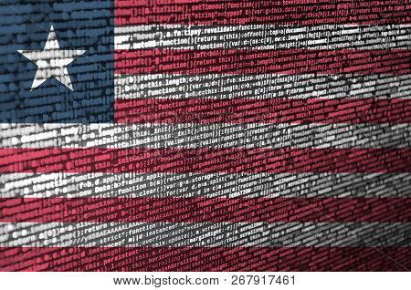 Liberia Flag  Is Depicted On The Screen With The Program Code. The Concept Of Modern Technology And 