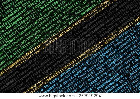 Tanzania Flag  Is Depicted On The Screen With The Program Code. The Concept Of Modern Technology And