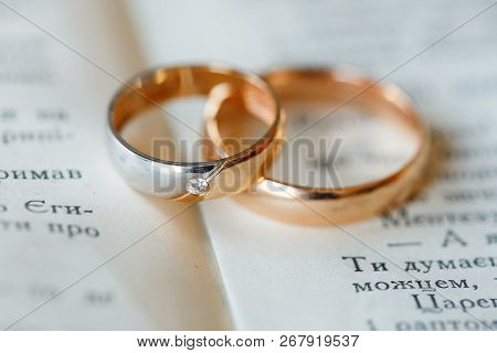 Engagement Wedding Gold Rings On A Book