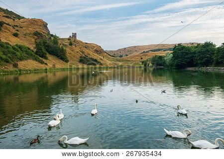 St Margaret’s Loch With Ruins Of St Anthony’s Chapel In The Background, Edinburgh, Scotland.