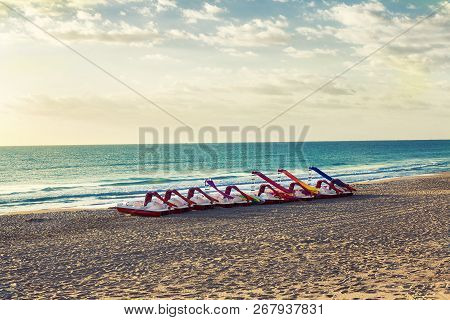 Red Pedal Boats On The Quiet Beach. Guardamar Del Segura. Alicante. Spain