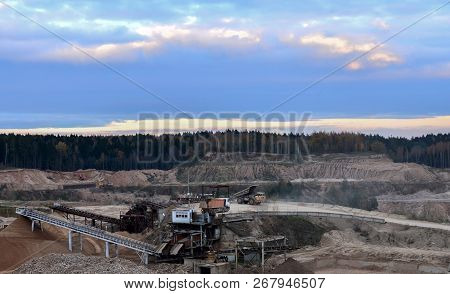 Earth Mover Loading Dumper Truck With Sand In Quarry. Excavator Loading Sand Into Dumper Truck.quarr