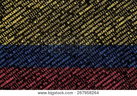 Colombia Flag  Is Depicted On The Screen With The Program Code. The Concept Of Modern Technology And
