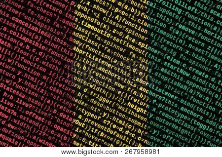 Guinea Flag  Is Depicted On The Screen With The Program Code. The Concept Of Modern Technology And S