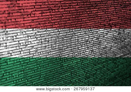 Hungary Flag  Is Depicted On The Screen With The Program Code. The Concept Of Modern Technology And 