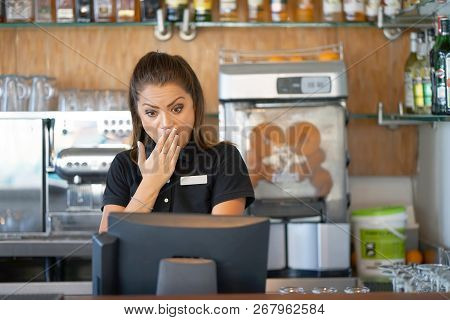 Female Bartender Hotel Bar Made A Mistake In The Bill, Emotion. A Barmaid Registrating New Order By 