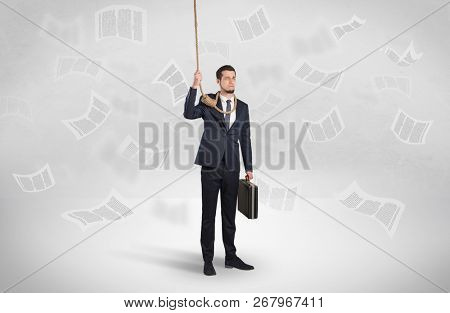 Young burnout businessman with flying documents concept
