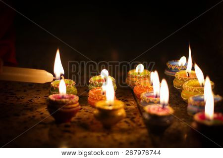 Earthen Diya Lamp Lighting With Candles On The Occasion Of Diwali And Sandhi Pujo