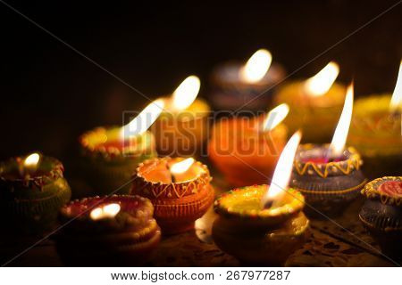 Earthen Diya Lamp Lighting With Candles On The Occasion Of Diwali And Sandhi Pujo