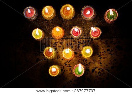 Earthen Diya Lamp Lighting With Candles On The Occasion Of Diwali And Sandhi Pujo