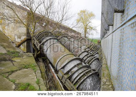 Outlet Pipes Of A Water Pumping Station. Pipes Of Large Diameter.