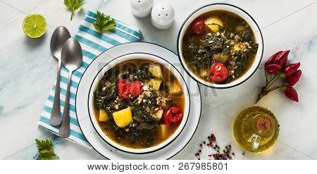 Banner Of Vegan Winter Kale Soup With Buckwheat , Cherry Tomatoes And Potatoes. Tasty Full Vegetable