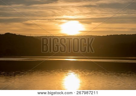 Sunset In The Ruidera Lagoons With The Golden Sky