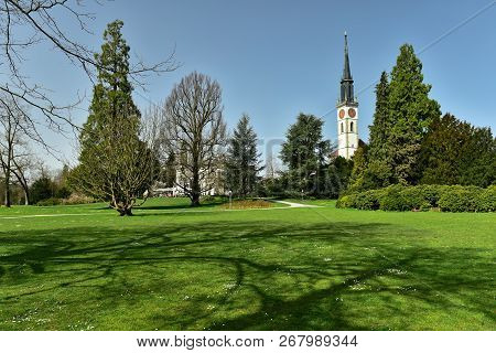 Villette-park In The Town Of Cham On A Spring Sunny Day. View Of The Saint Jacob Church. Cham, Canto