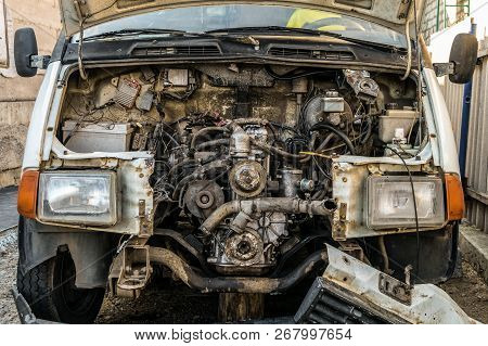 Engine Compartment Of An Old Car. Open Hood With Old Cars Details, Auto-waste.