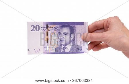 Female Hand Holding A 20  Moroccon Dirham Banknote Isolated On A White Background. Denomination Of 2